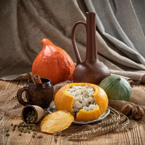 Obraz na płótnie Still life with baked stuffed pumpkin w salonie