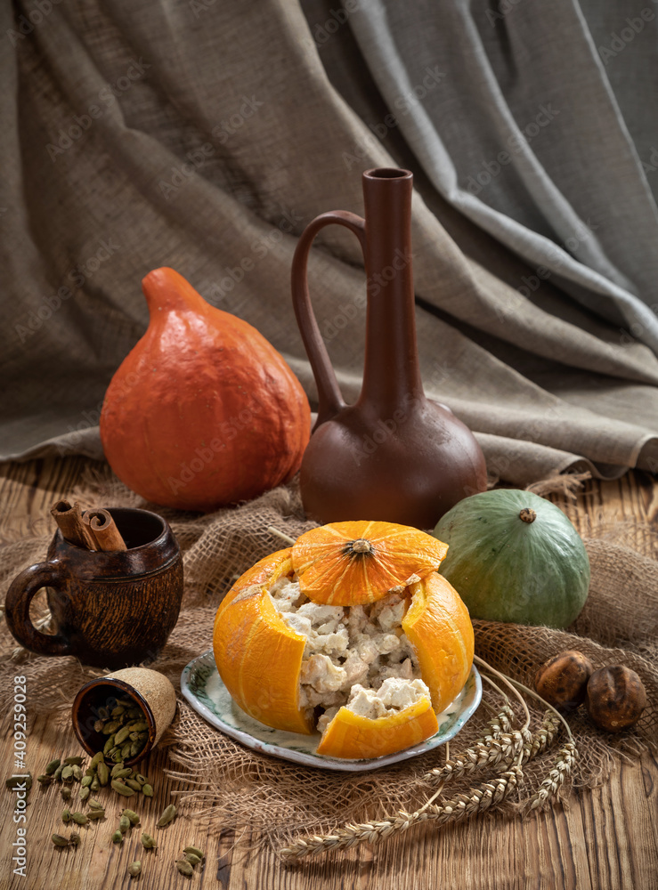 Still life with baked stuffed pumpkin