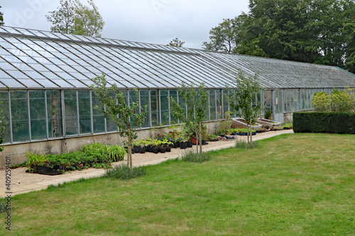 A large greenhouse in the kitchen garden of an English country houseA large greenhouse in the kitchen garden of an English country house