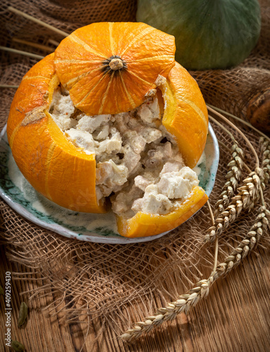 Still life with baked stuffed pumpkin