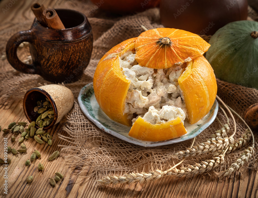 Still life with baked stuffed pumpkin