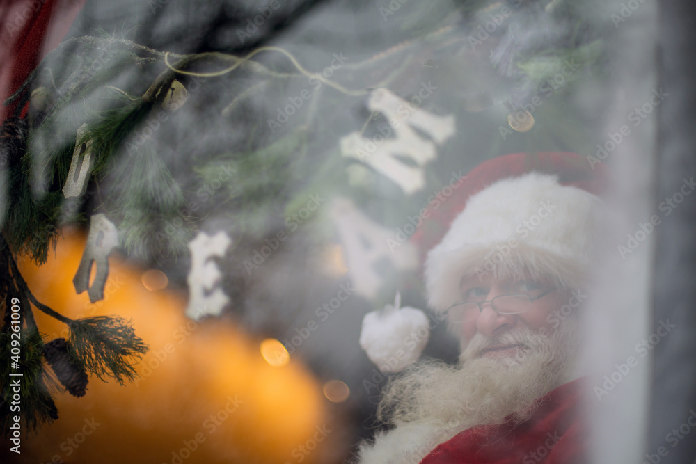 Santa sits in Window during covid Santa sits in Window during covid
