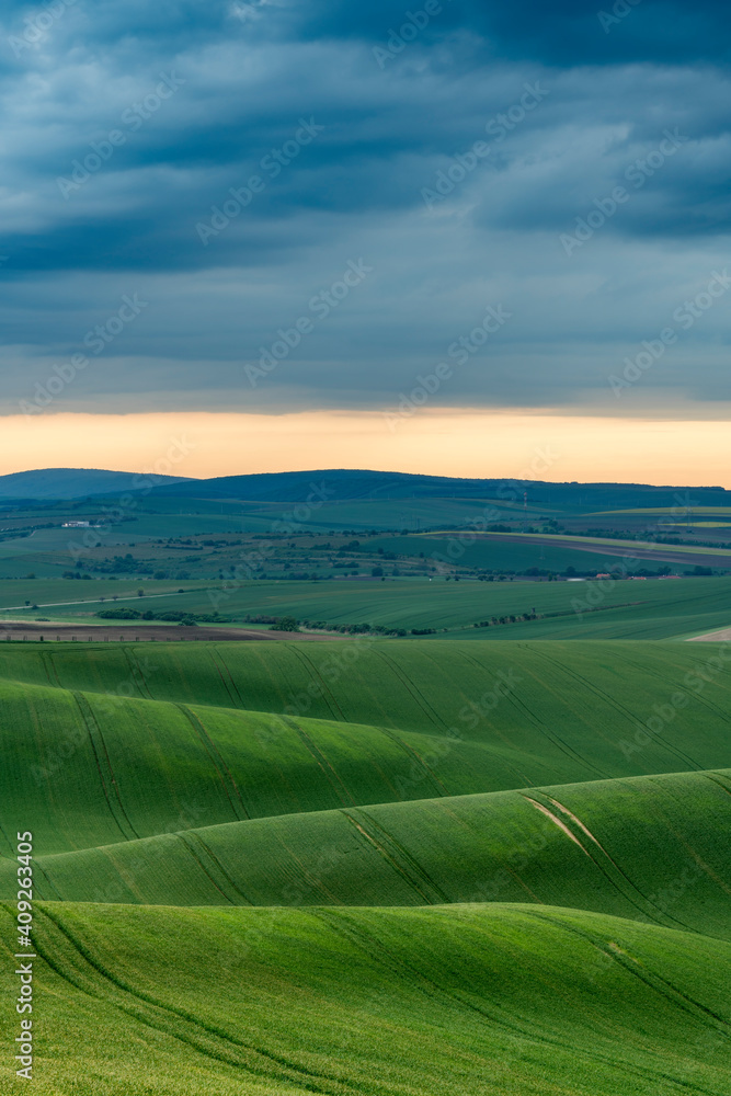 Scenic view of green rolling hills near Kyjov with dramatic storm clouds, Hodonin District, South Moravian Region, Moravia, Czech Republic Scenic view of green rolling hills near Kyjov with dramatic storm clouds, Hodonin District, South Moravian Region, Moravia, Czech Republic