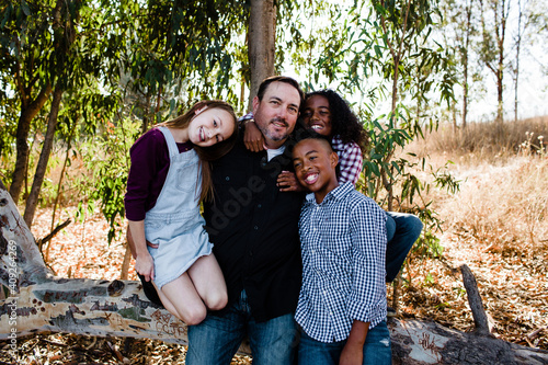 Dad & Kids Hugging & Smiling for Camera at Park in Chula Vista photo