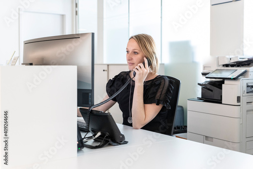 a medical secretary answers the phone photo