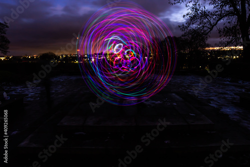 Silhouette Circus Model in Queens Park Bolton at Night in the Snow with Light Trails photo