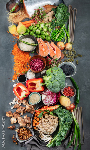Asian raw vegan food  grain  seeds and vegetables on dark background