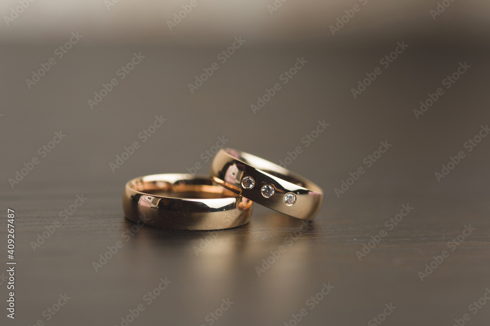 closeup of golden rings on table closeup of golden rings on table