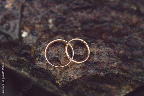 two rings on wet stone