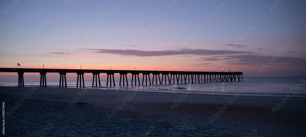 Silhoutted Ocean Pier at Sunrise