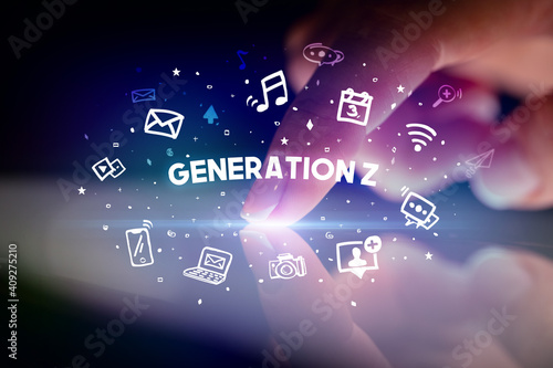 Finger touching tablet with drawn social media icons and GENERATION Z inscription  social networking concept