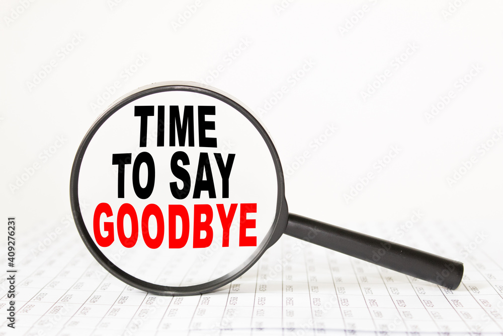 words TIME TO SAY GOODBYE in a magnifying glass on a white background. business concept words TIME TO SAY GOODBYE in a magnifying glass on a white background. business concept