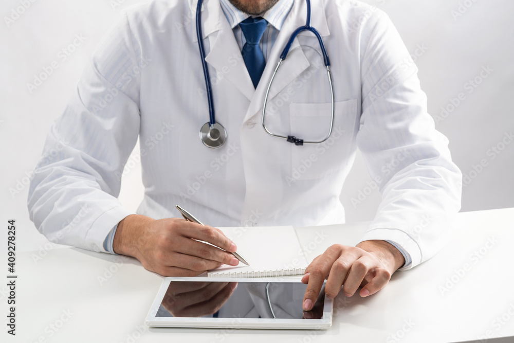 Close up of doctor hands using tablet computer Close up of doctor hands using tablet computer