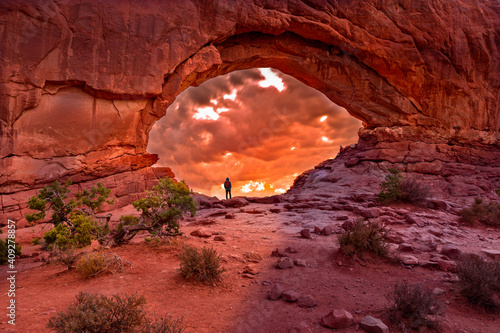 Enjoying the sunrise in the North Window Arch, Arches National Park Utah photo