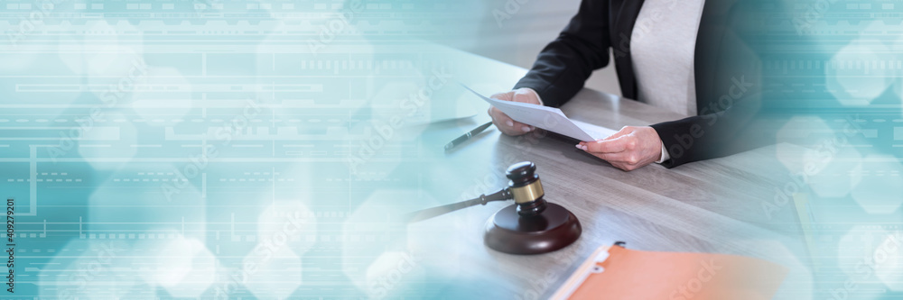 Female lawyer working on document; panoramic banner Female lawyer working on document; panoramic banner