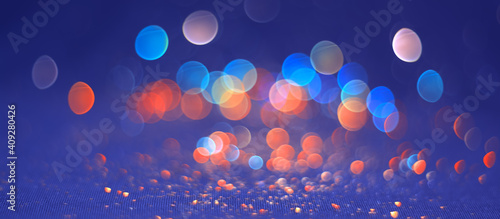 Beautiful abstract blue orange bokeh background. Colored lights blurred