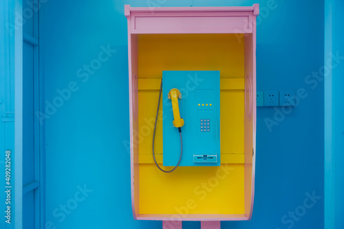 Tableau sur toile Bright multicolored city phone booth
