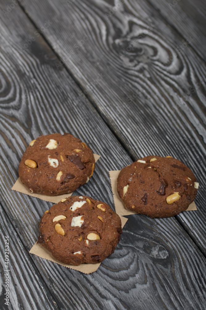 Oatmeal cookies with peanuts and chocolate. On pine boards. Oatmeal cookies with peanuts and chocolate. On pine boards.