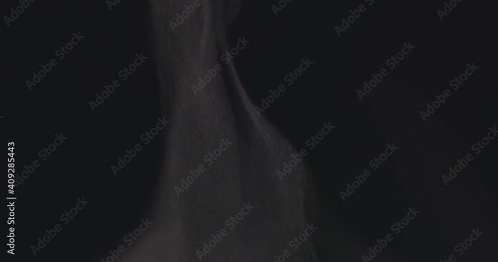 Steam rising from below against dark background Steam rising from below against dark background