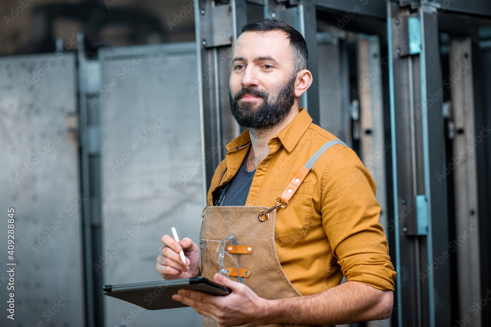 Worker with a digital tablet at the plant Worker with a digital tablet at the plant