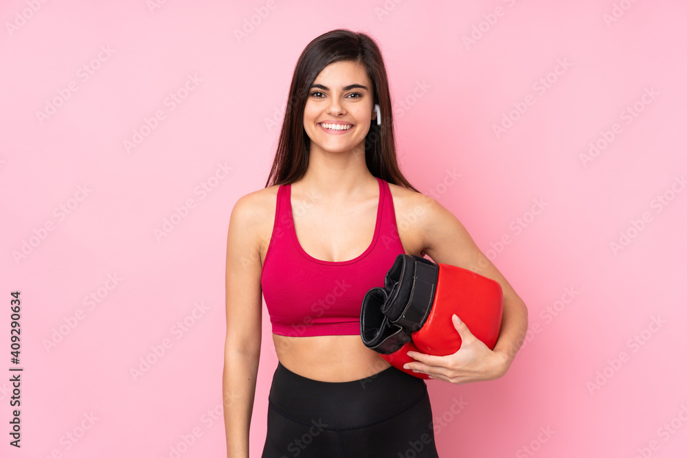 Young sport woman over isolated pink background with boxing gloves Young sport woman over isolated pink background with boxing gloves