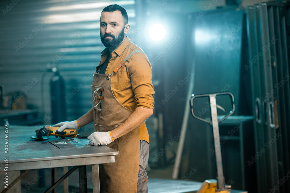 Man working with metal at the workshop Man working with metal at the workshop