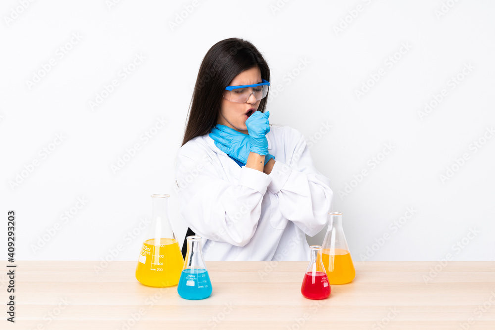 Young scientific woman in a table is suffering with cough and feeling bad Young scientific woman in a table is suffering with cough and feeling bad