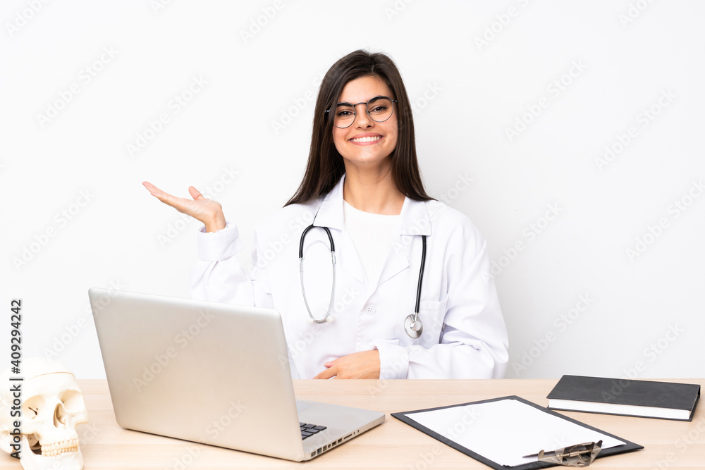 Professional traumatologist in workplace holding copyspace imaginary on the palm Professional traumatologist in workplace holding copyspace imaginary on the palm