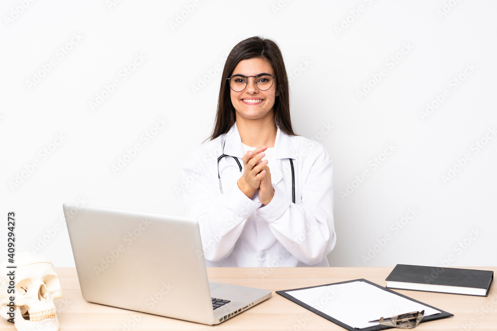 Professional traumatologist in workplace applauding Professional traumatologist in workplace applauding