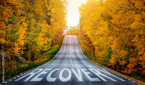 Fotografie Country road and Recovery written on the road