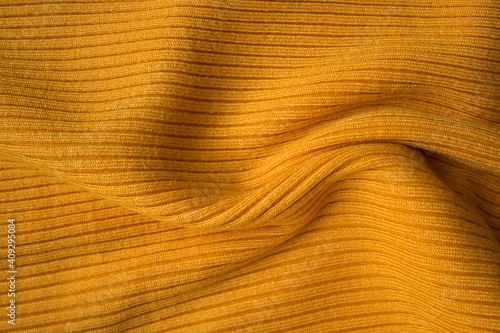 texture of cotton and acrylic fabric with yellow striped pattern, clothing details, background design