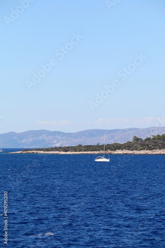 Sailing boat near island  in Croatia. Beautiful Mediterranean landscape. © jelena990