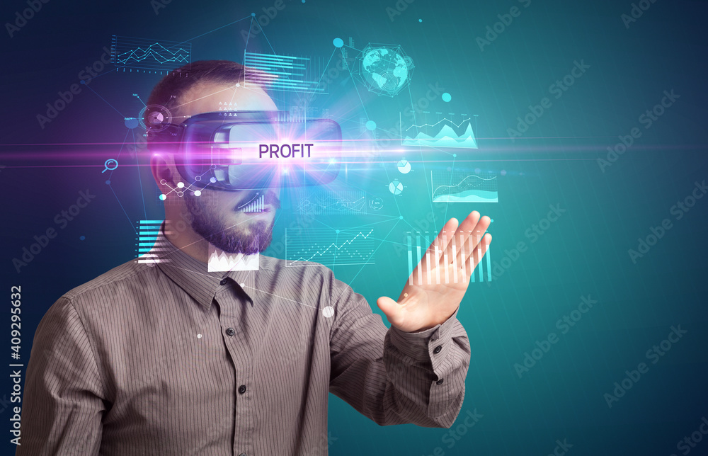 Businessman looking through Virtual Reality glasses with PROFIT inscription, new business concept Businessman looking through Virtual Reality glasses with PROFIT inscription, new business concept
