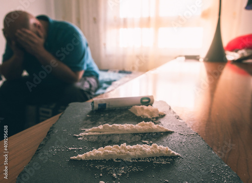 Man addicted to cocaine, suffering alone. Drug addiction concept photo