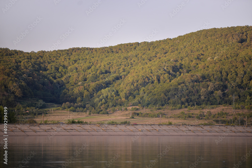 green forest reflecting in the luster of the lake green forest reflecting in the luster of the lake