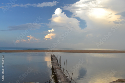 Beautiful view of a wooden platform leading to the sea in Puri, India photo