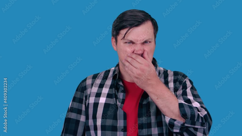 Portrait of a man, closing his nose, something stinks. Negative human facial expressions, emotions, feelings, reaction, attitude, behavior, perception. Portrait of a man, closing his nose, something stinks. Negative human facial expressions, emotions, feelings, reaction, attitude, behavior, perception.
