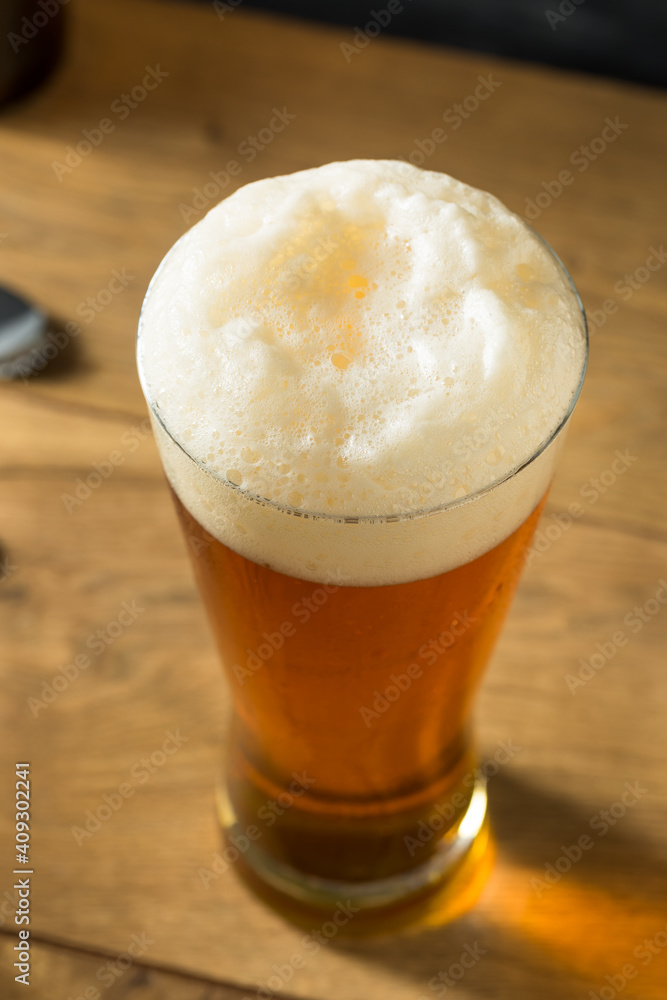Boozy Golden Beer Ale in a Tall Glass Boozy Golden Beer Ale in a Tall Glass