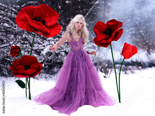 Beautiful blonde girl in violet dress among poppy flowers in winter