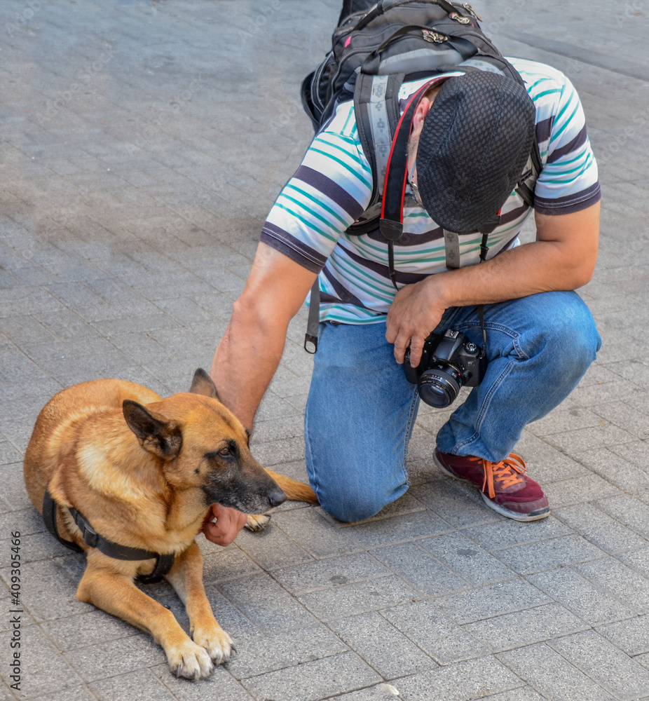 Photographer with dog on the street Photographer with dog on the street