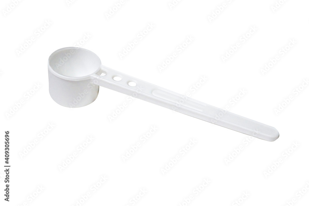 White plastic measuring spoon isolate on a white background close-up. White plastic measuring spoon isolate on a white background close-up.