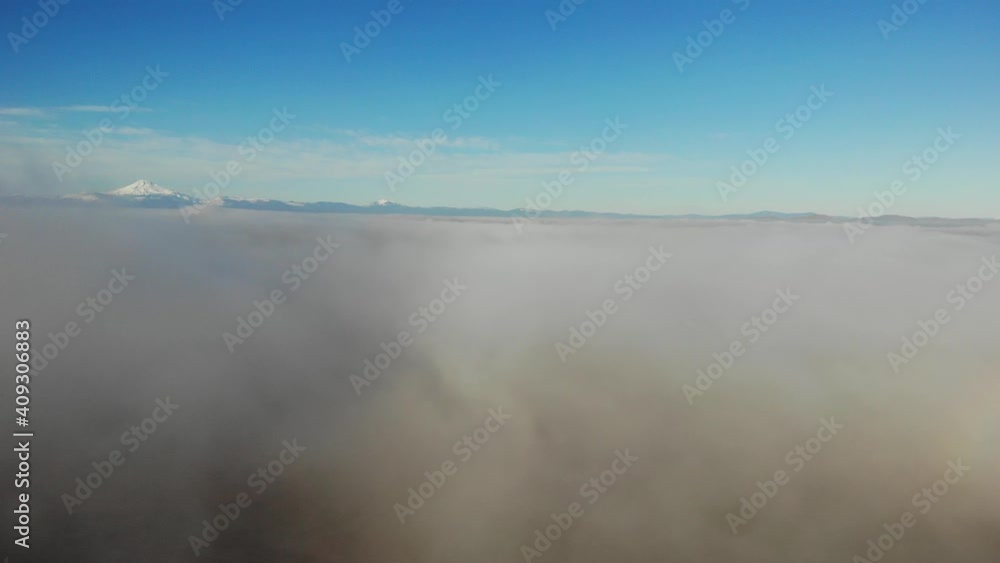 Drone flight landing descent into clouds foggy desert seen dimly Drone flight landing descent into clouds foggy desert seen dimly