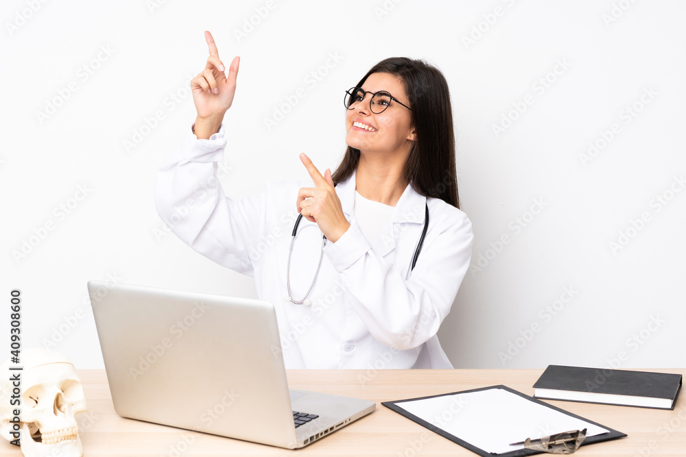 Professional traumatologist in workplace pointing with the index finger a great idea