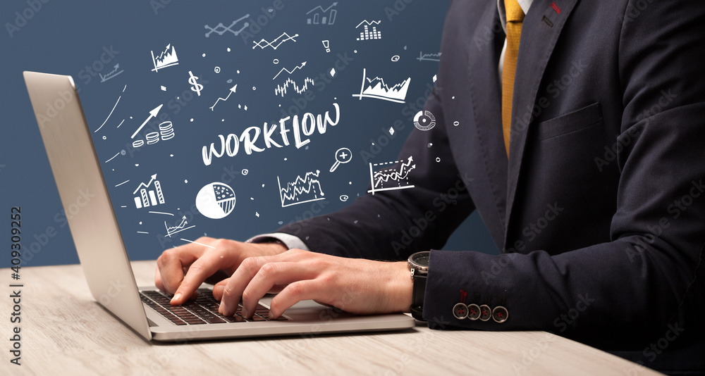 Businessman working on laptop with WORKFLOW inscription, modern business concept Businessman working on laptop with WORKFLOW inscription, modern business concept