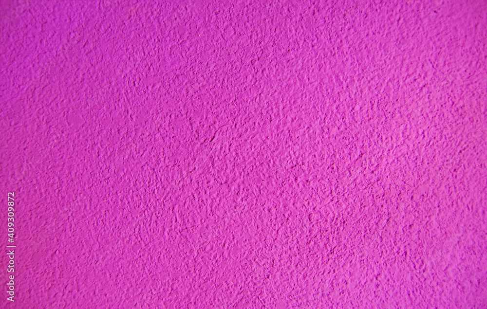 Abstract grainy texture on magenta wall. It can be used as a design element and background Abstract grainy texture on magenta wall. It can be used as a design element and background