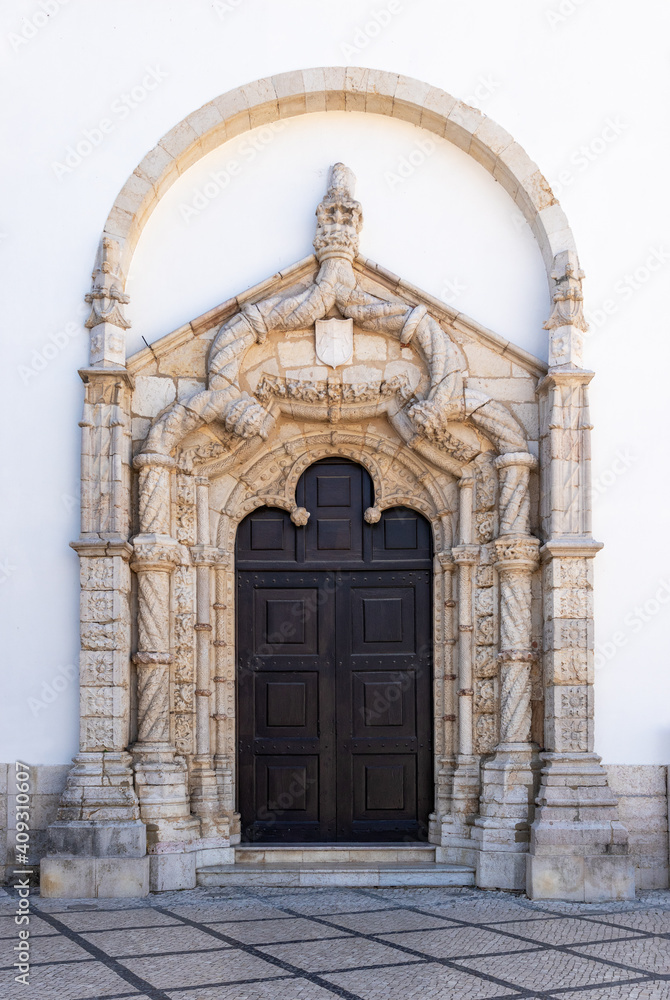 Manueline portal of the left side facade of the Church of São Julião in Setúbal, Portugal.