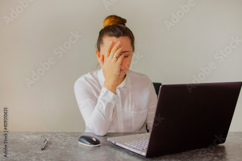 Office worker girl tired in the office