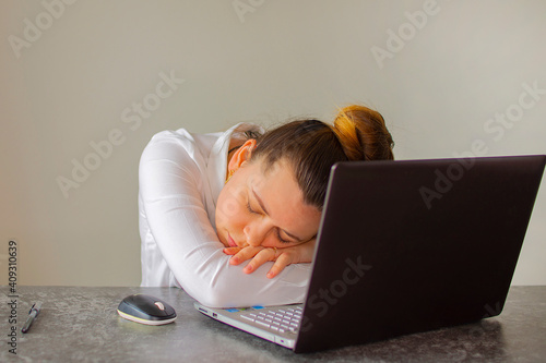 Office worker sleeping on laptop