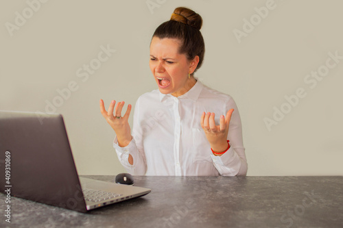 Angry accountant in front of the computer