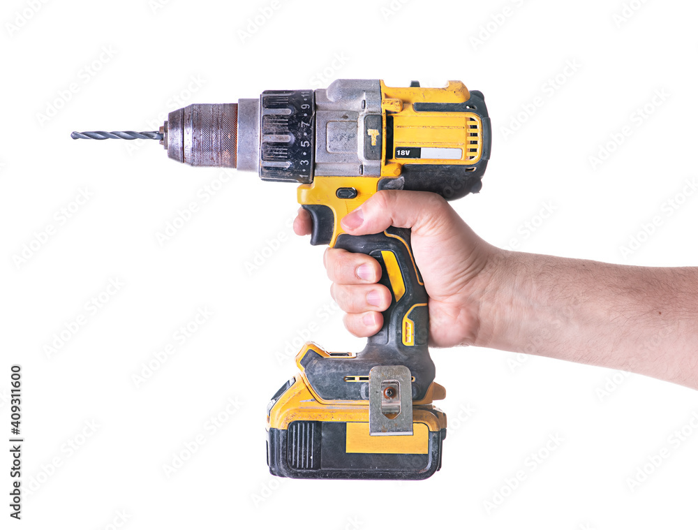 Yellow cordless battery powered drill isolated on white background. Yellow cordless battery powered drill isolated on white background.